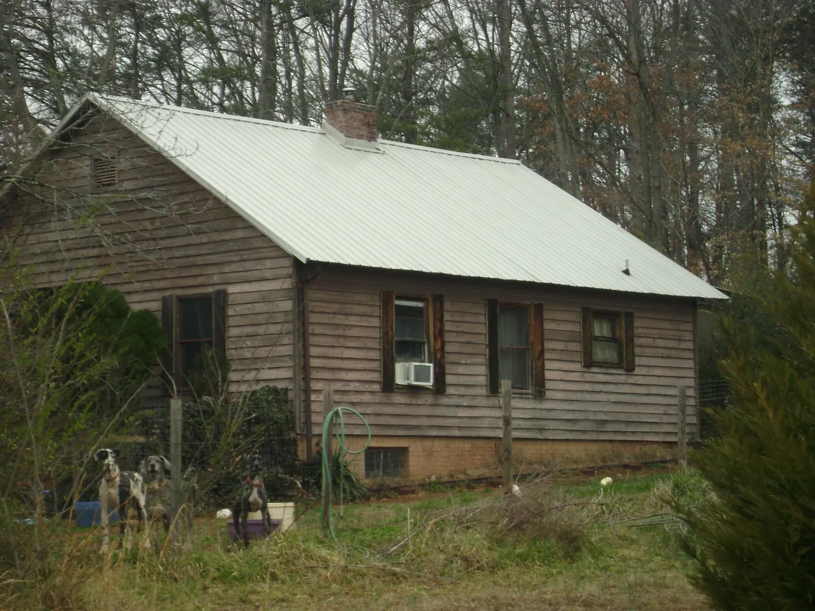 White metal roof on an old wood sided farmhouse in Bunker Hill